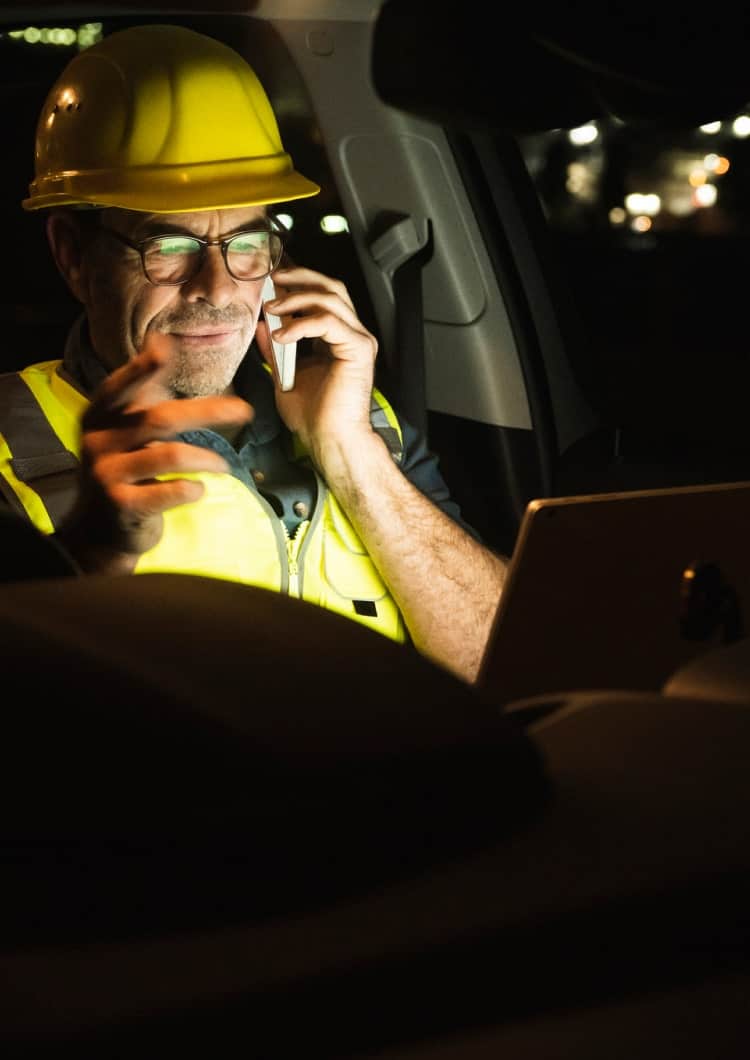 man using devices in vehicle