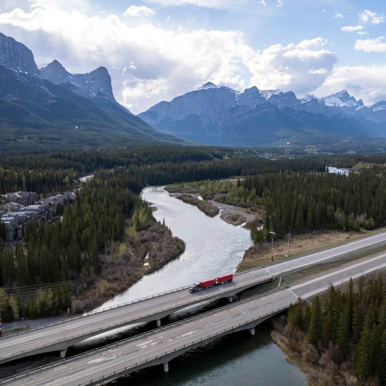 truck driving over bridge