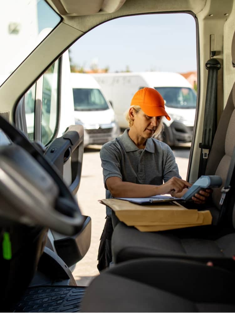 trucker using phone in truck