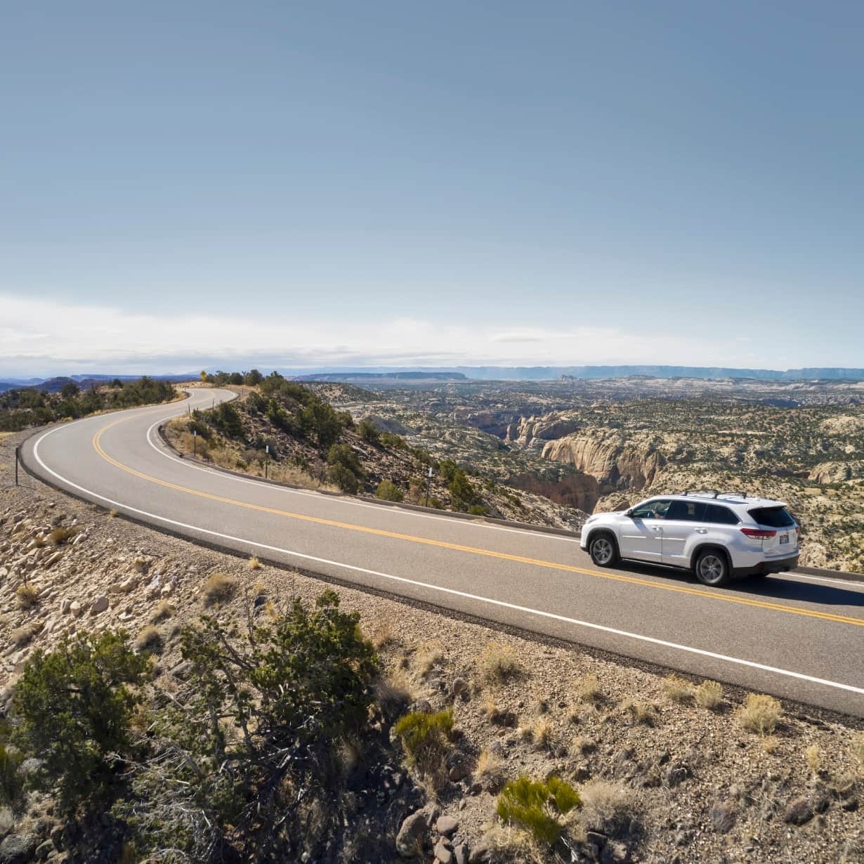 SUV driving on a desert highway