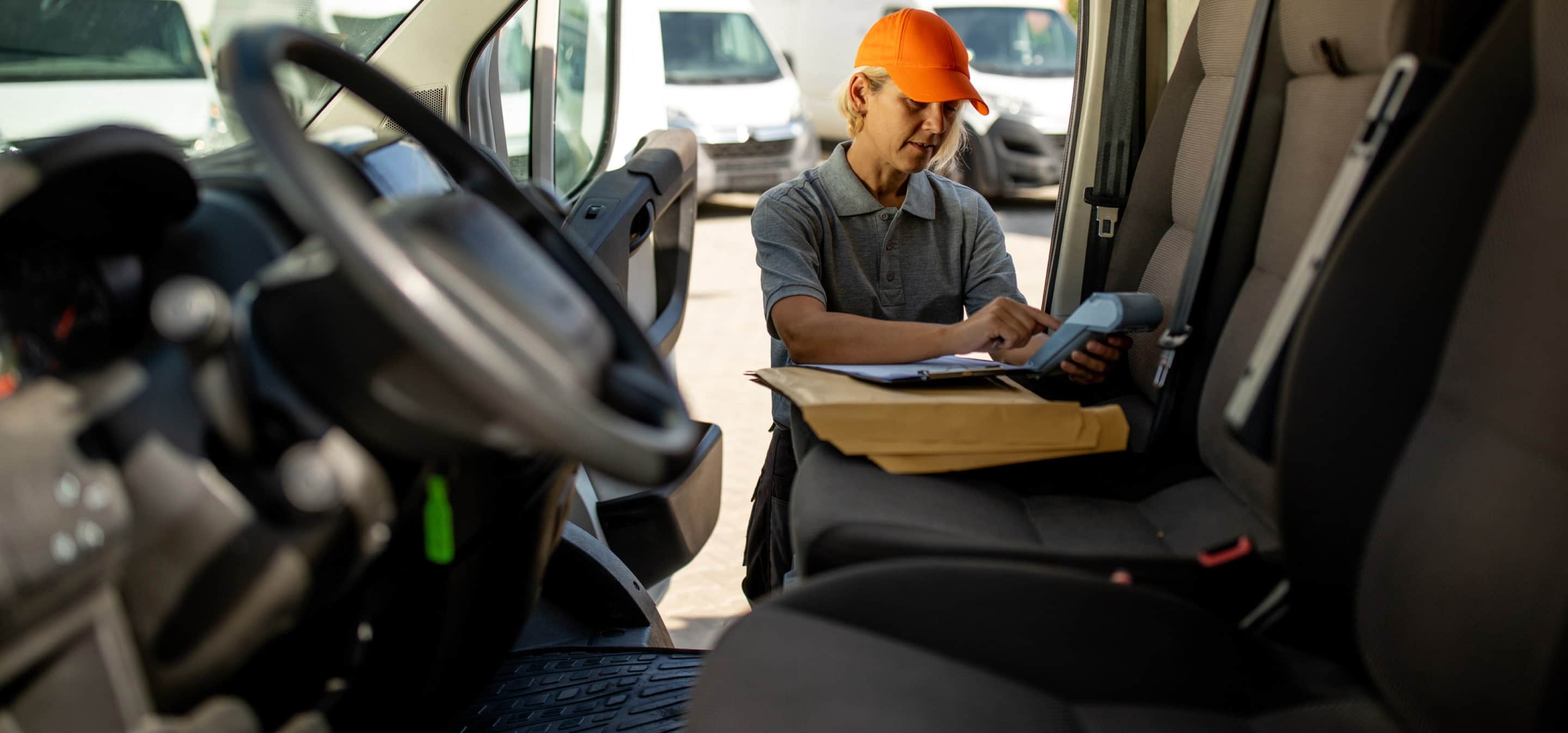 trucker using phone in truck