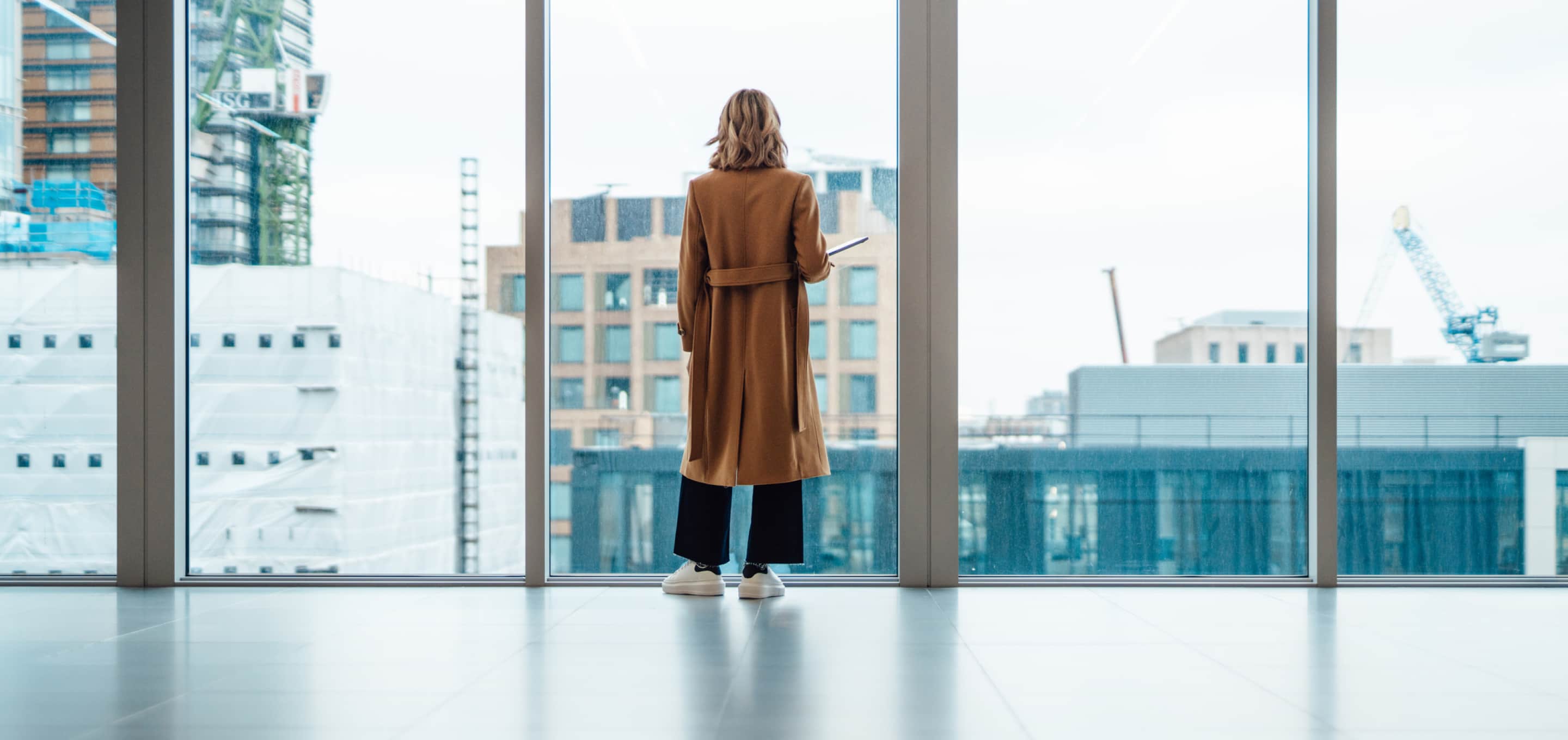 woman looking out window